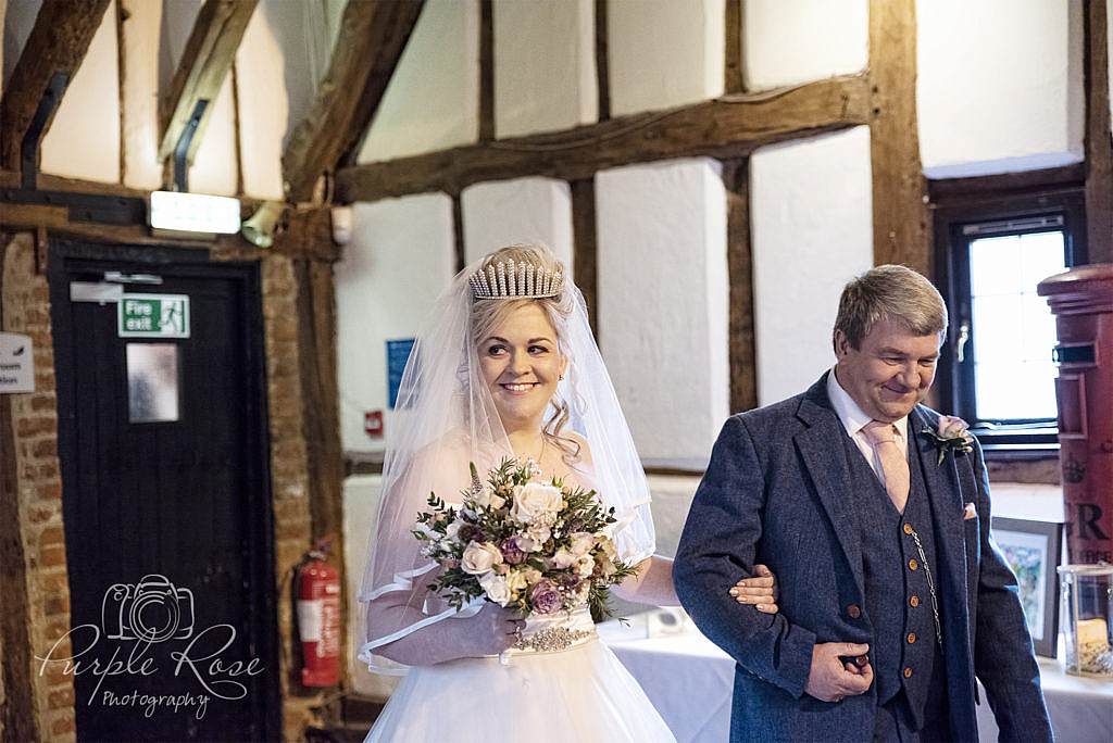 Father walking his daughter to her wedding ceremony