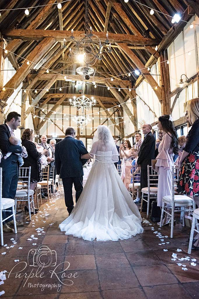 Father walking his daughter to her wedding ceremony