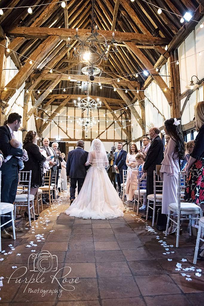 Father walking his daughter to her wedding ceremony