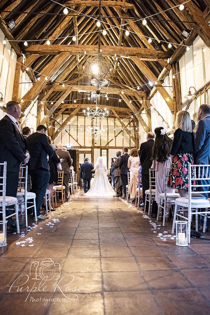 Father walking his daughter to her wedding ceremony