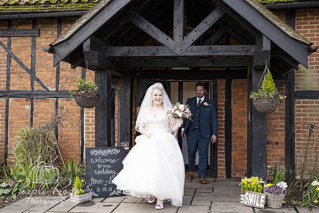 Bride and groom leaving the wedding ceremony