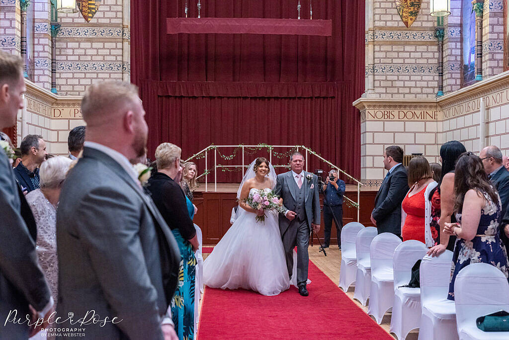 Bride walking with her father in the Guildhall Northampton