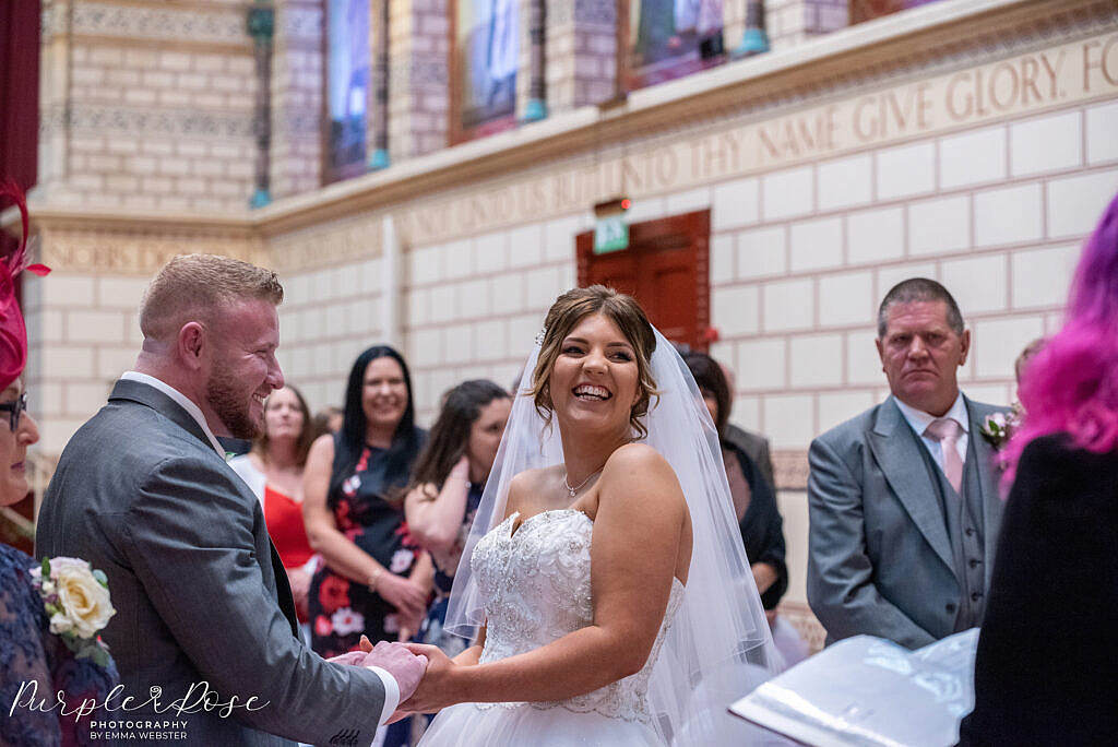 Bride and groom holding hands