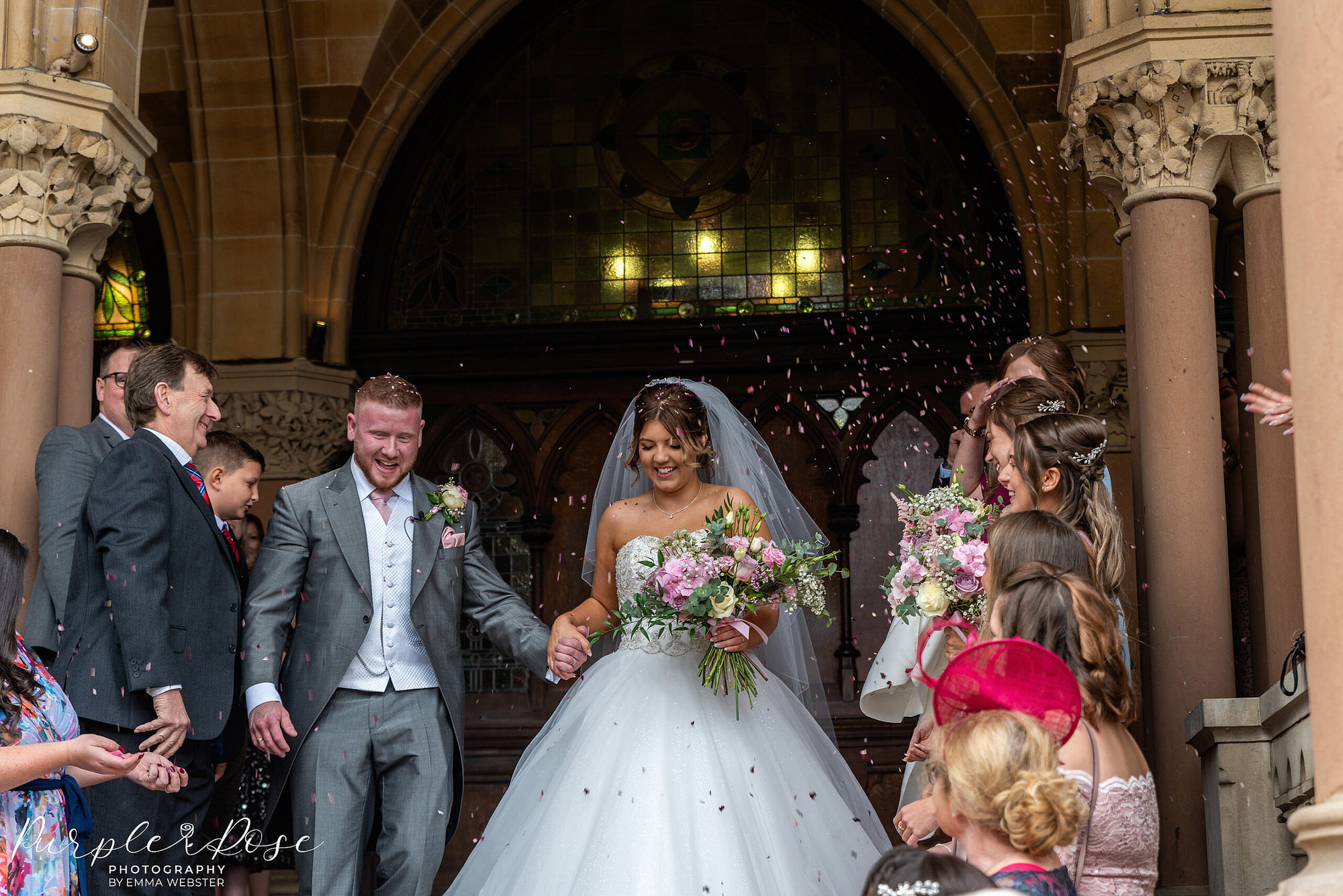 Bride and groom leaving the Guildhall