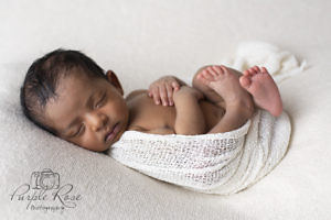 Curled up sleeping baby