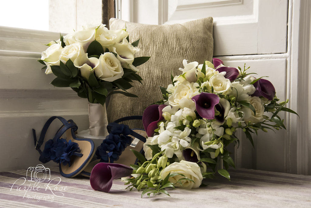 Photo of brides bouquet, brides maids bouquet and brides shoes.
