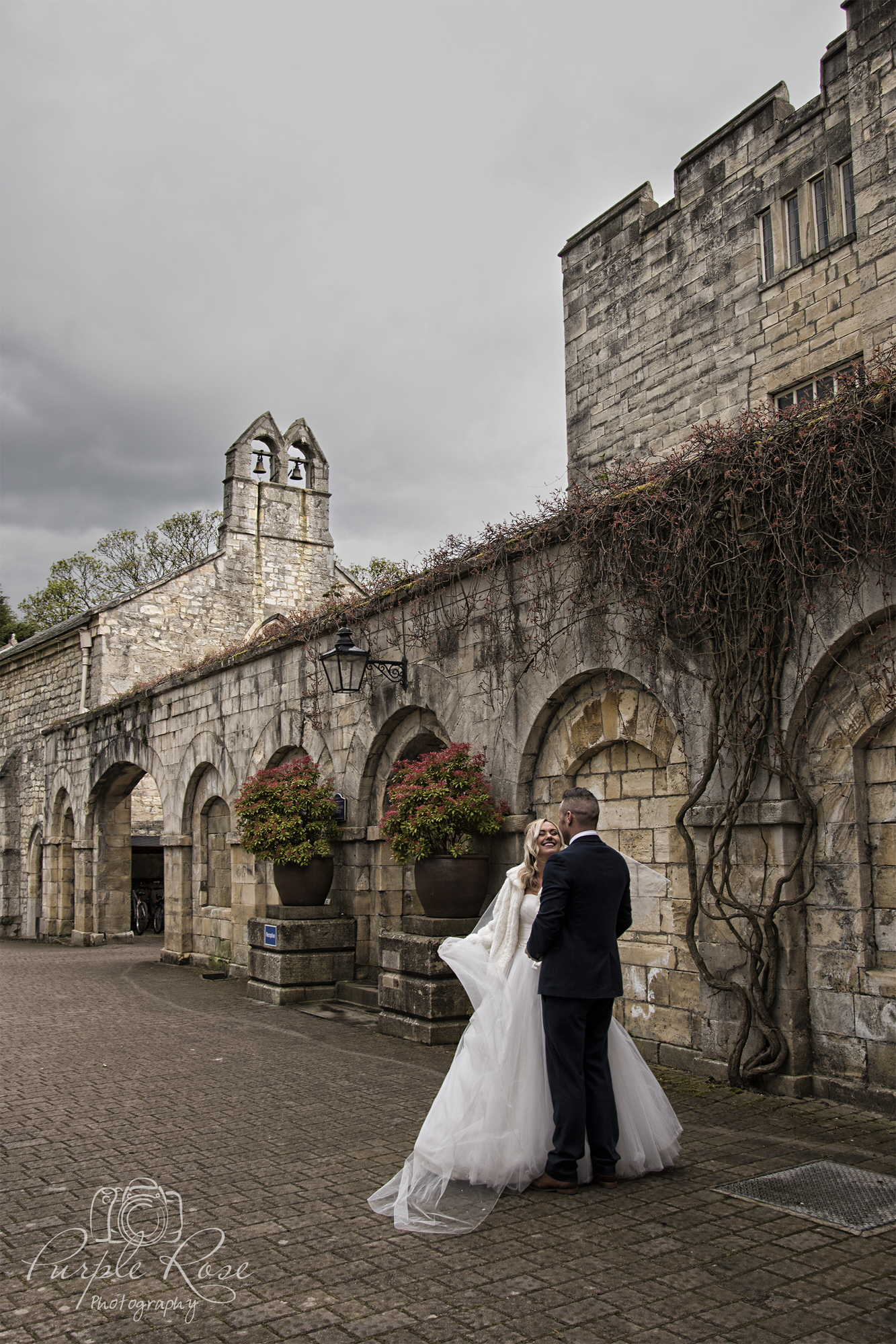 Bride and groom standing outside the church