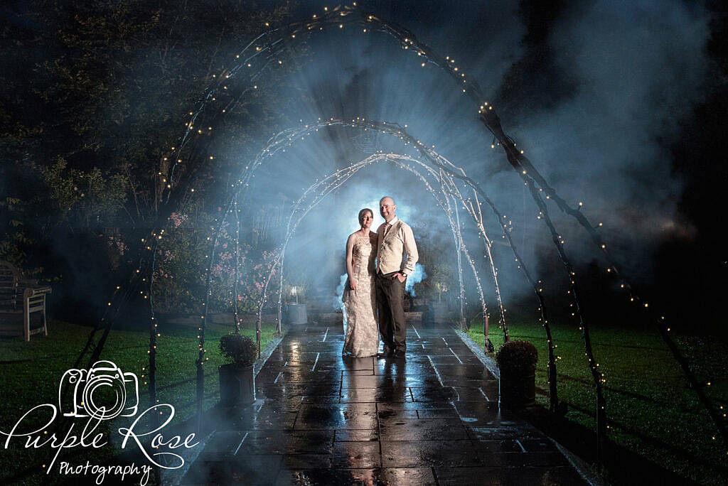 Dramatic night time photo of bride and groom
