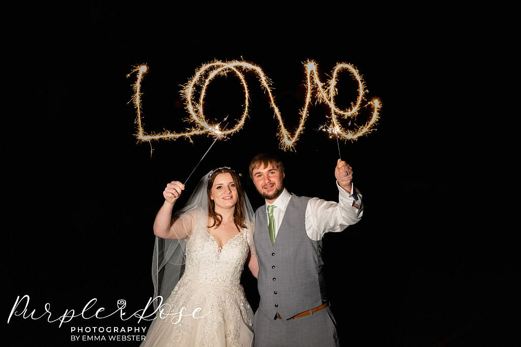 Bride and groom with sparklers