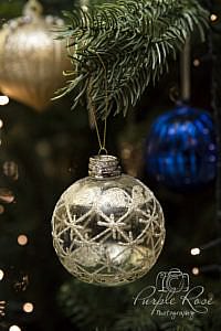 Wedding rings on a Christmas bauble