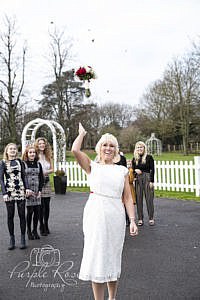 Bride throwing her bouquet