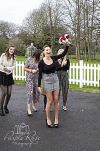 Woman catching brides bouquet