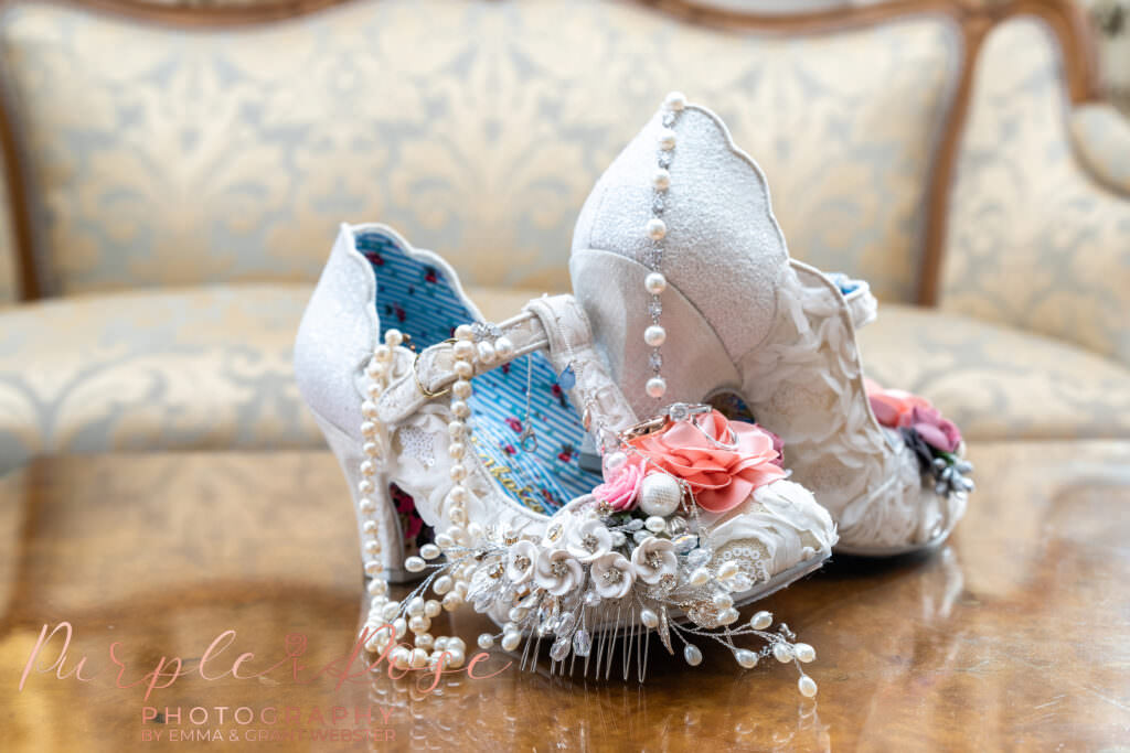 Photograph of brides wedding shoes and jewllery  in Milton Keynes