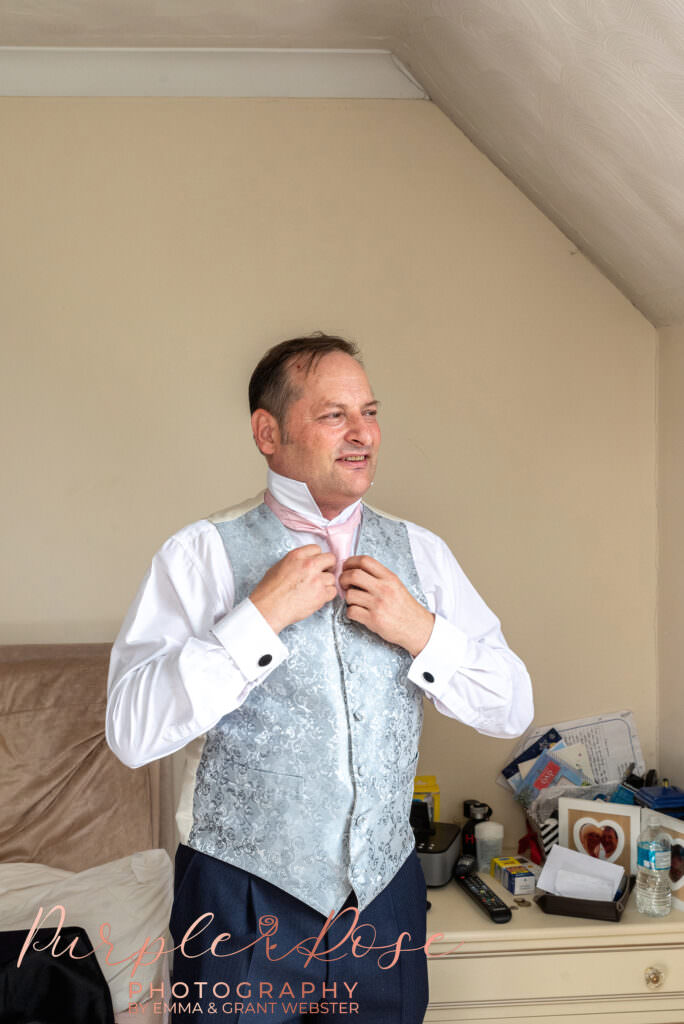 Photograph of groom getting ready on his wedding day  in Milton Keynes