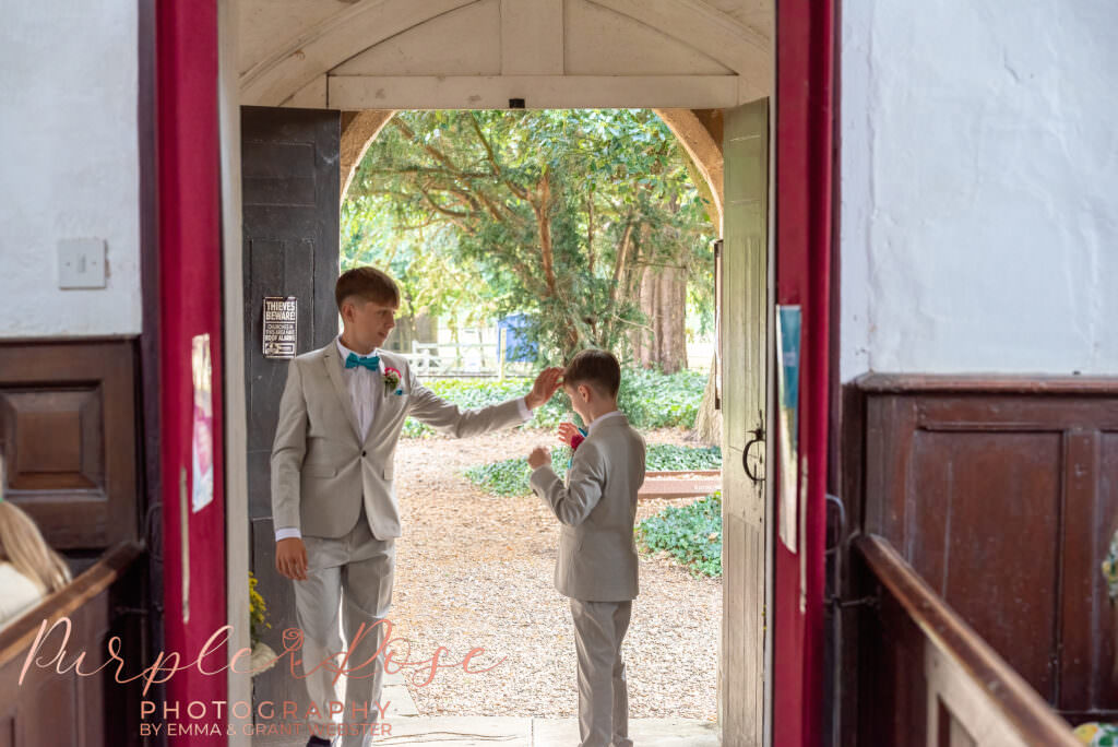 Photo of page boys playing before wedding ceremony starts  in Milton Keynes