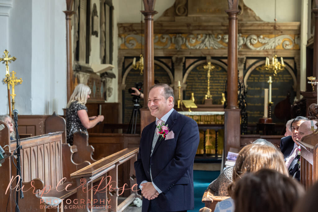 Photograph of groom waiting for his bride to arrive at Chicheley Church  in Milton Keynes