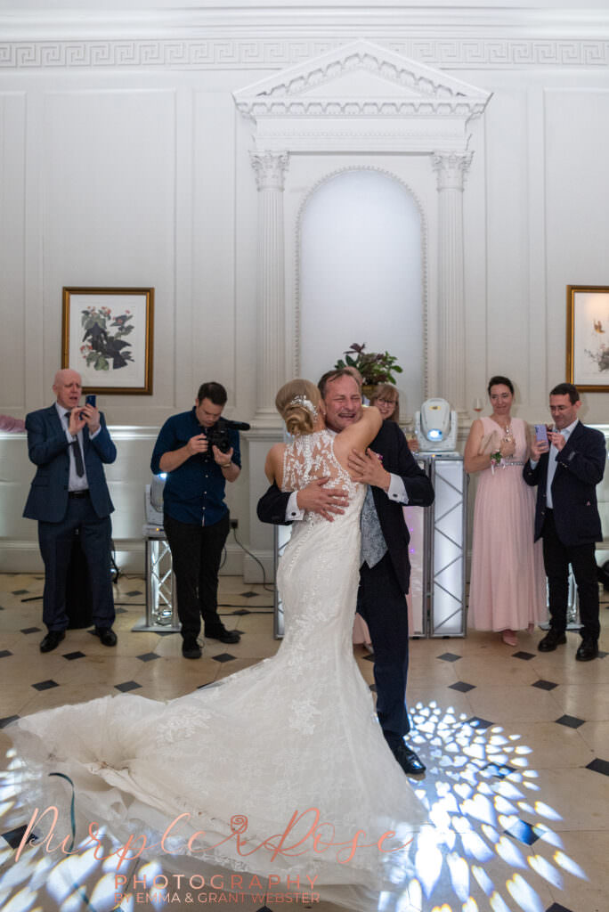 bride twirling in the air during her first dance  in Milton Keynes
