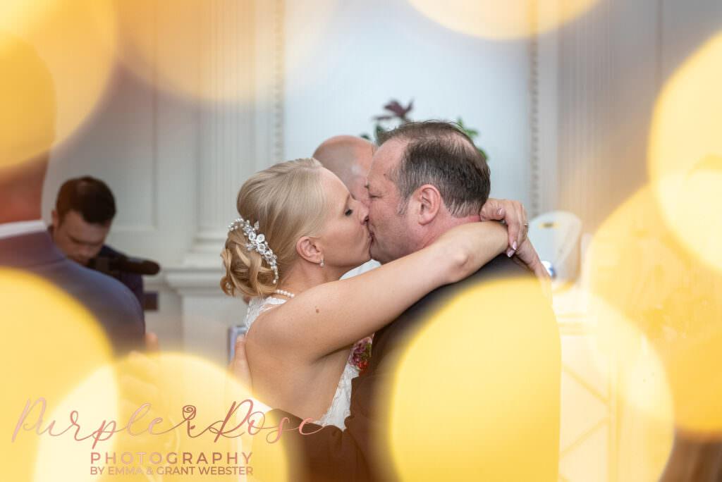 Photograph of couple kissing during their first dance in Milton Keynes