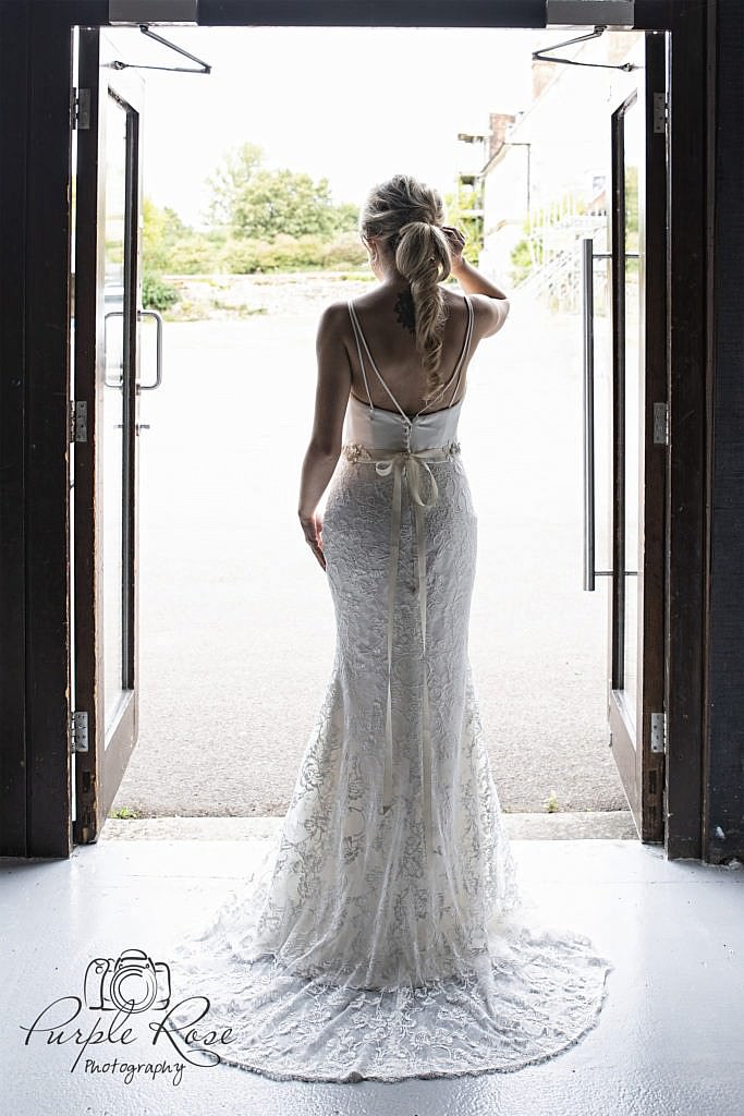 Detailing of the back of a brides dress