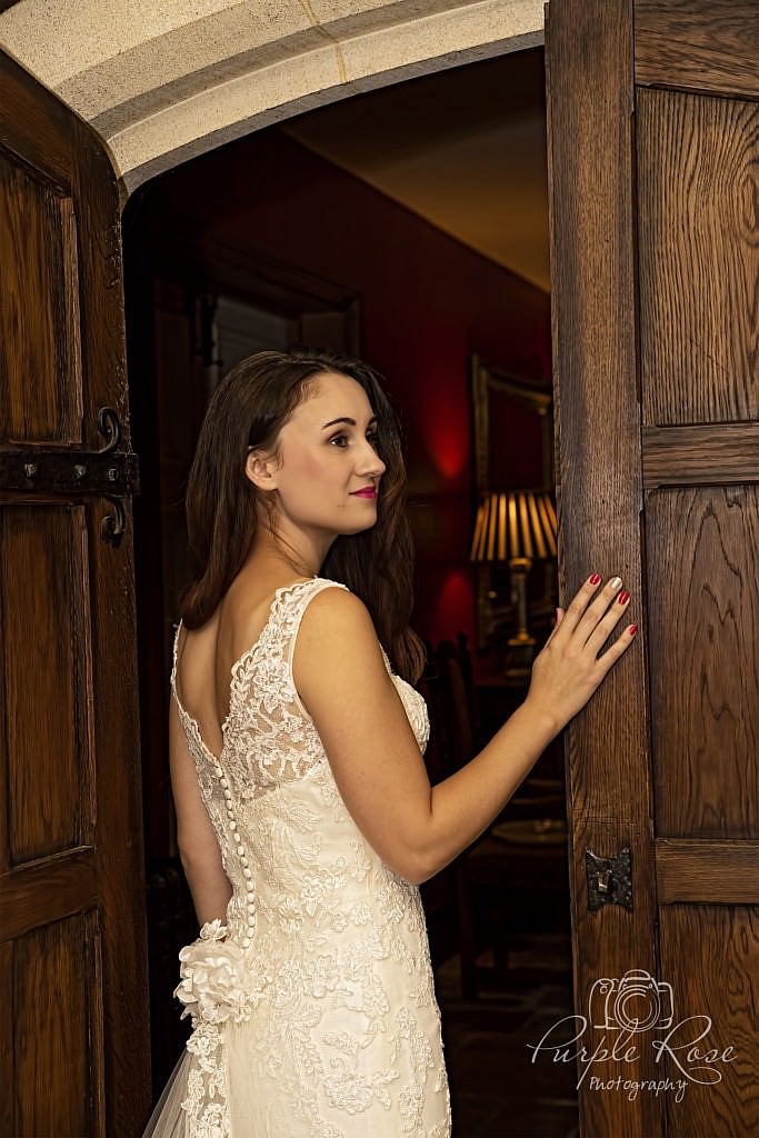 Bride standing by a door