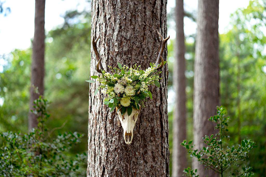 Wedding flowers in a forest on an animal skull