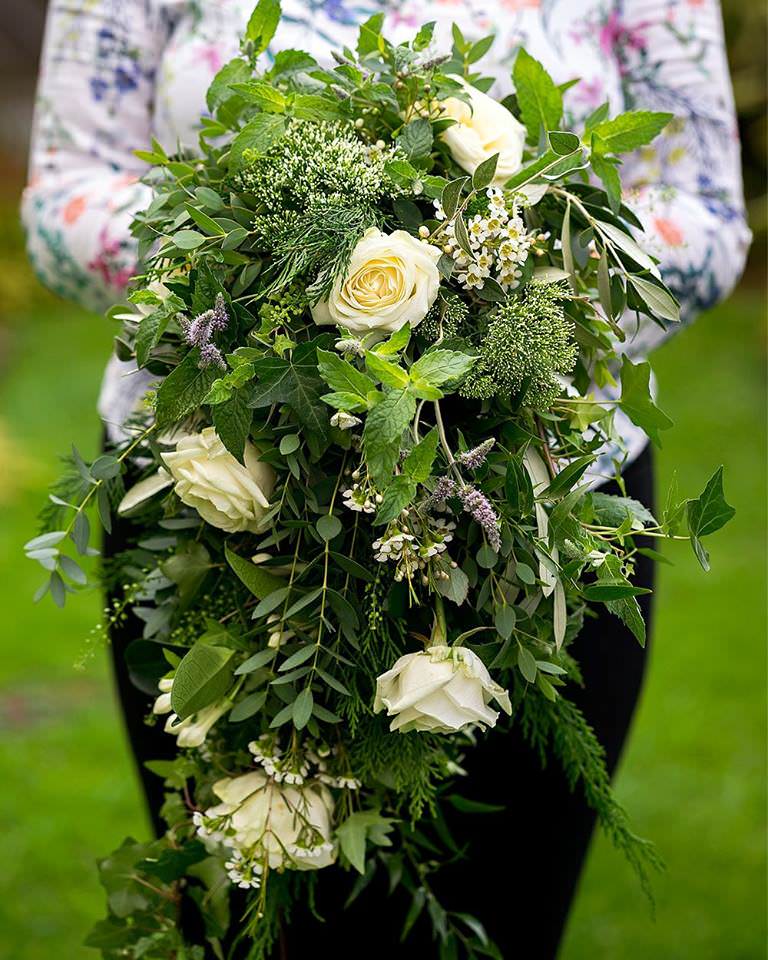 White bridal bouquet with foliage