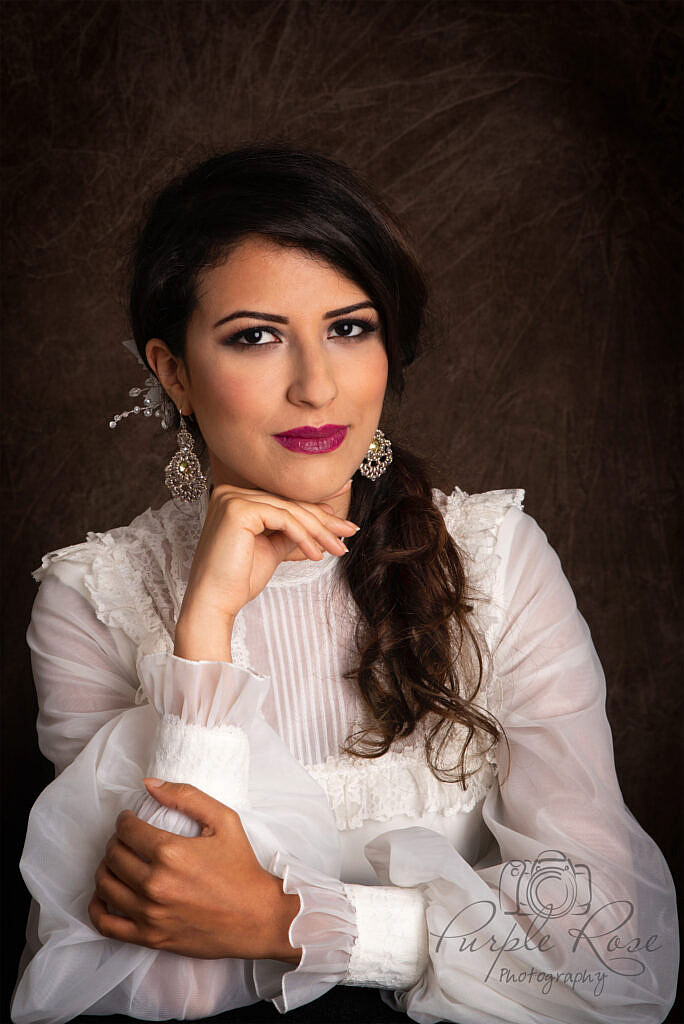 Head shot photo of woman in vintage wedding dress