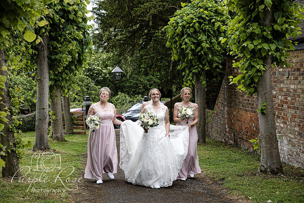 Bride and Bridesmaids walking to the church