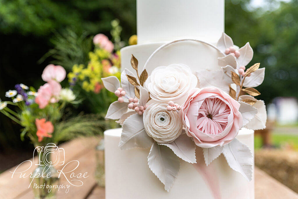 Close up of a wedding pink, white and green wedding cake