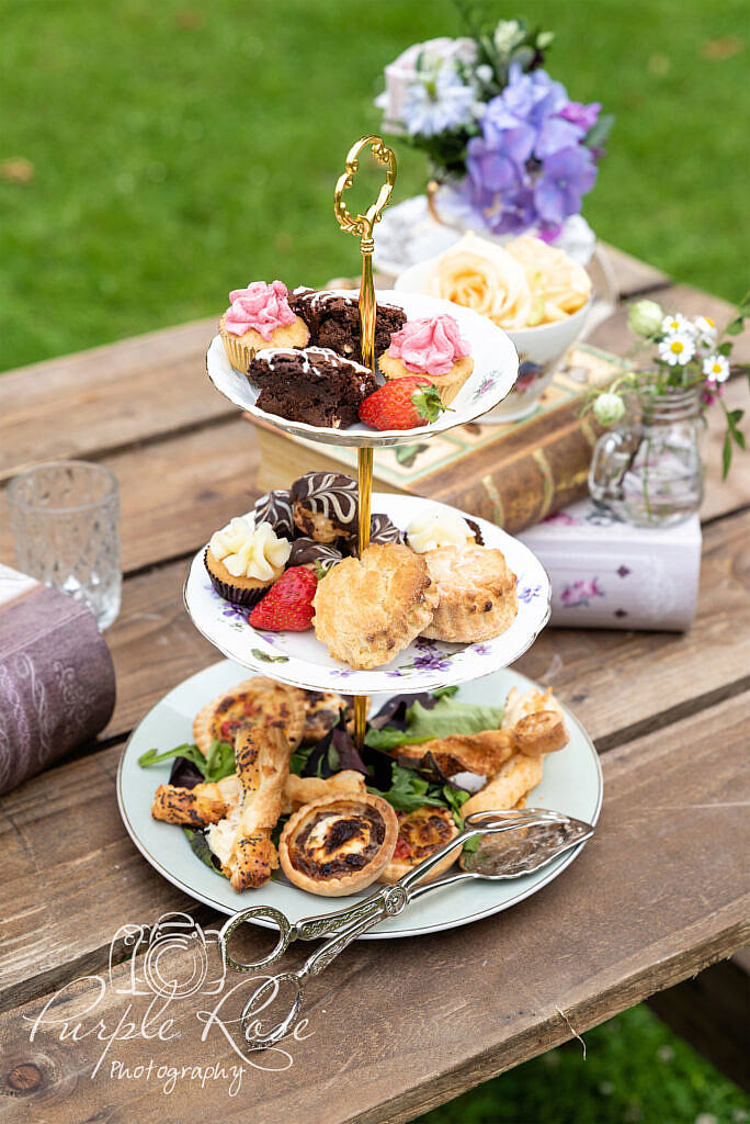 Afternoon tea food surrounded by flowers