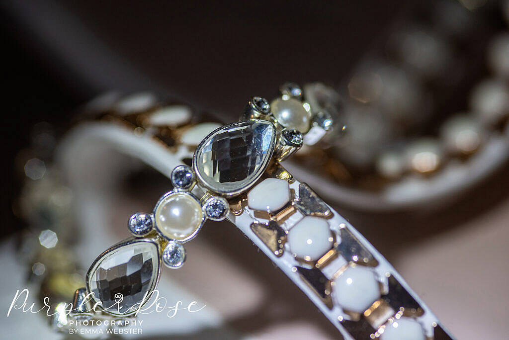 Detail of a brides shoes and bracelet