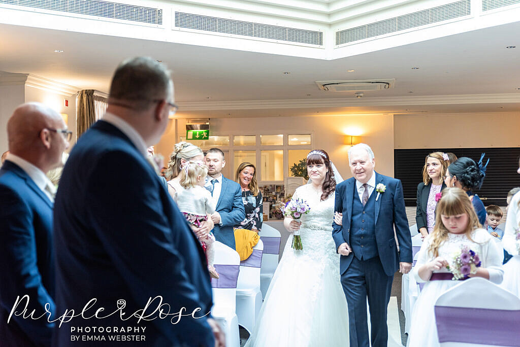 bride walking to her groom