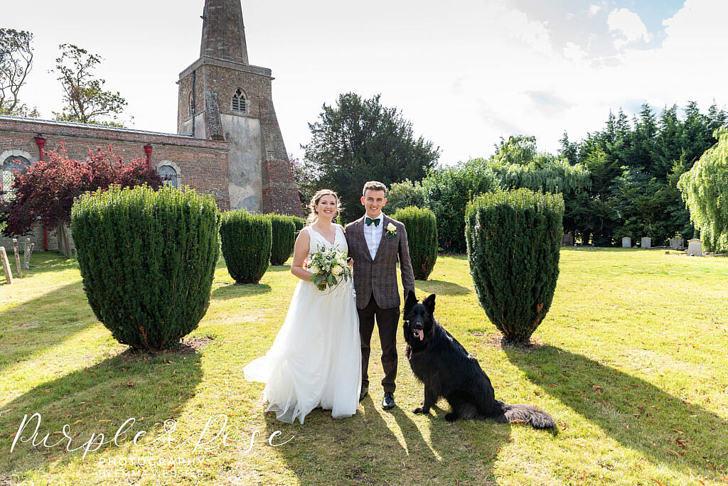 Bride and groom with their dog