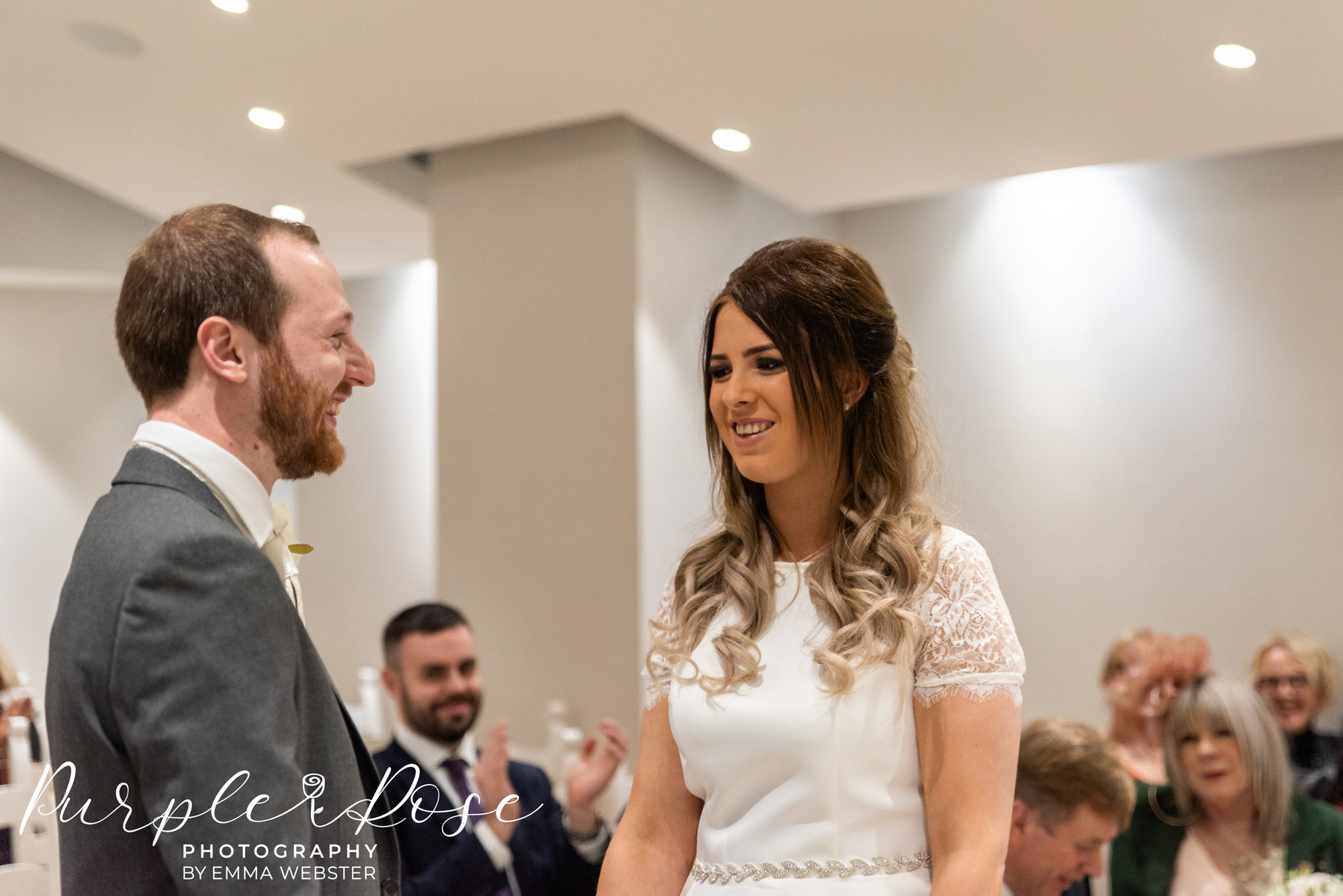 Bride and groom laughing during the ceremony