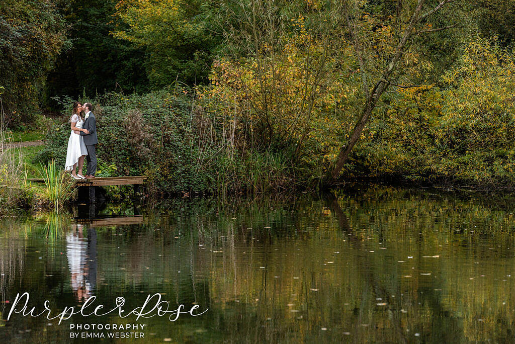 Bride and groom by a lake