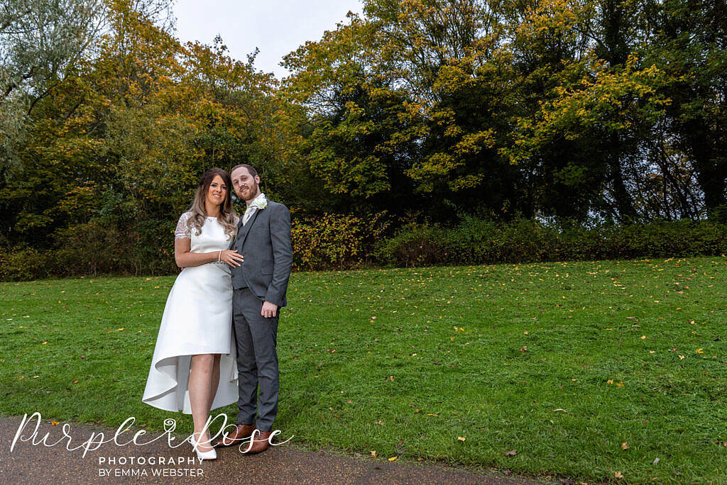 Bride and groom enjoying the autumn setting