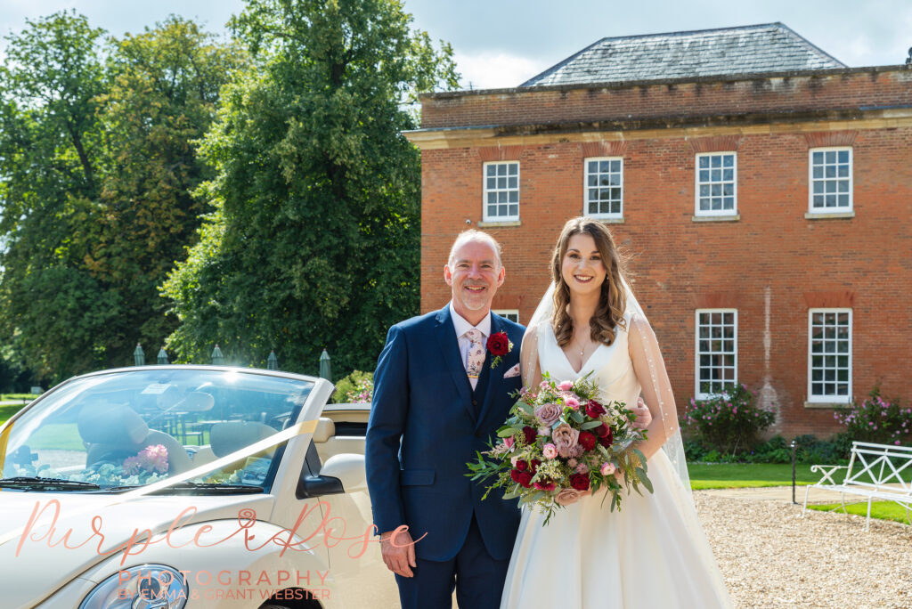 Photo of bride and her father outside her wedding venue in Milton Keynes