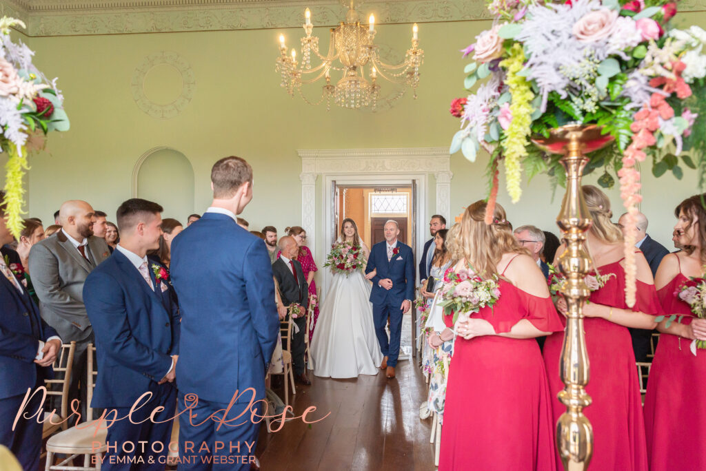 Photo of bride walking into her wedding ceremony in Milton Keynes