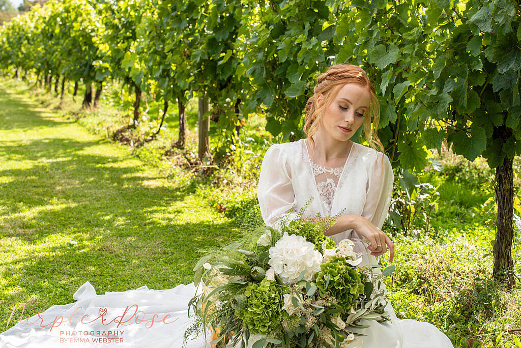 Bride sat with her bouquet