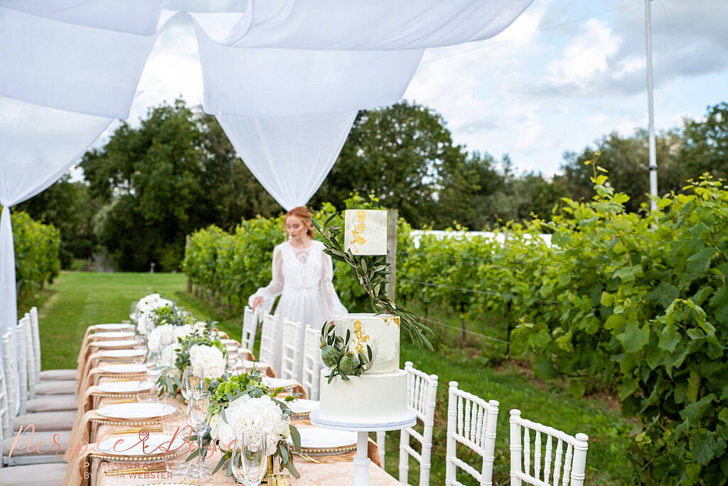 Bride looking at wedding reception set up