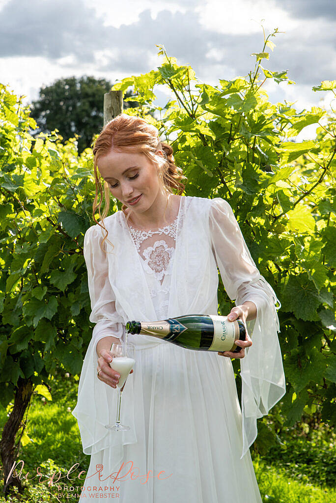 Bride pouring champagne