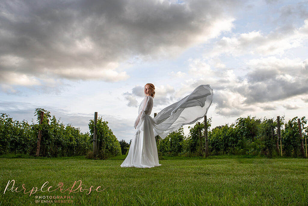 Bride in front of dramatic sky