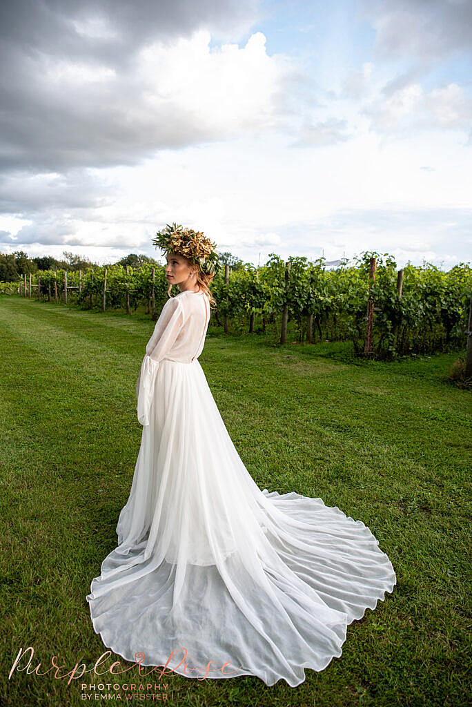 Brides gown flowing behind her