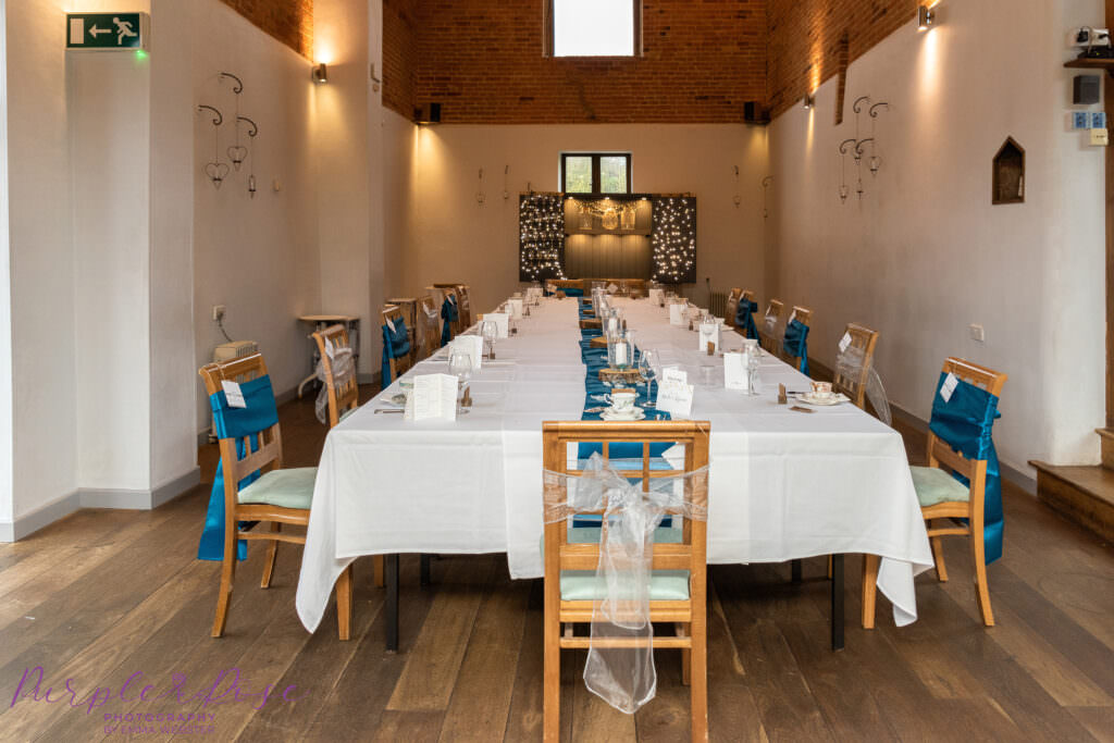 Wedding barn set up for reception meal