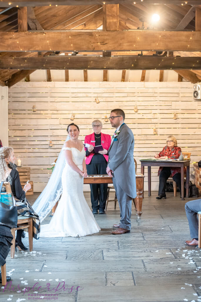 Bride looking at her guests during wedding ceremony