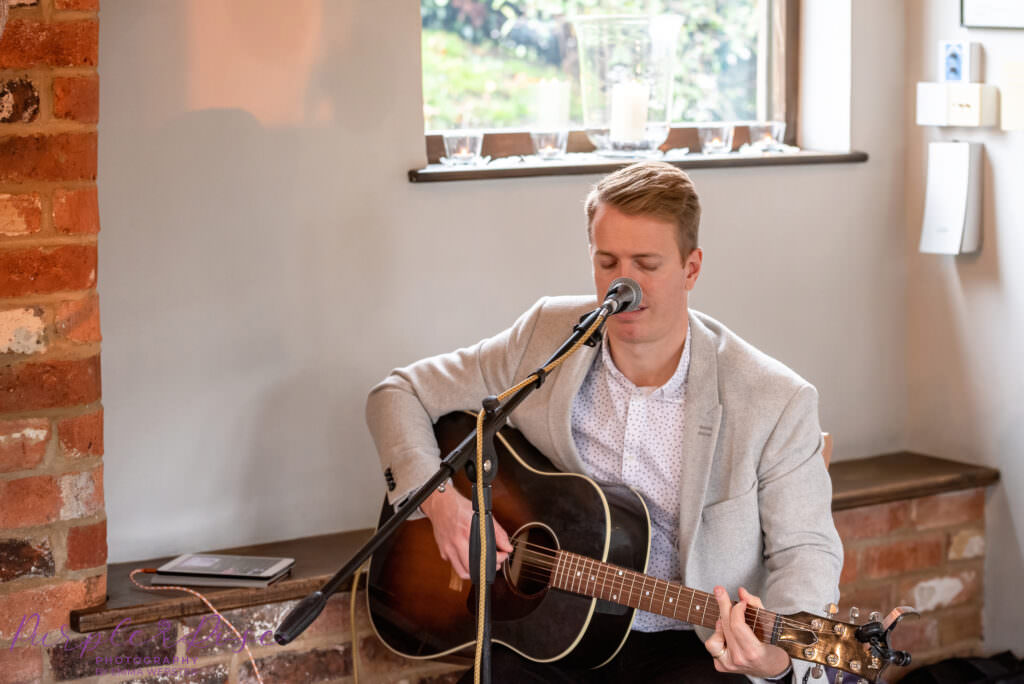 Professional wedding signer, singing and playing guitar