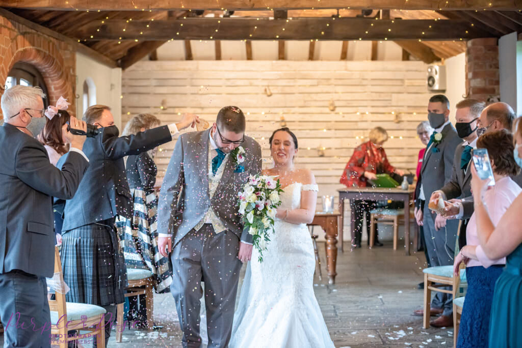 Bride and groom leaving the wedding ceremony