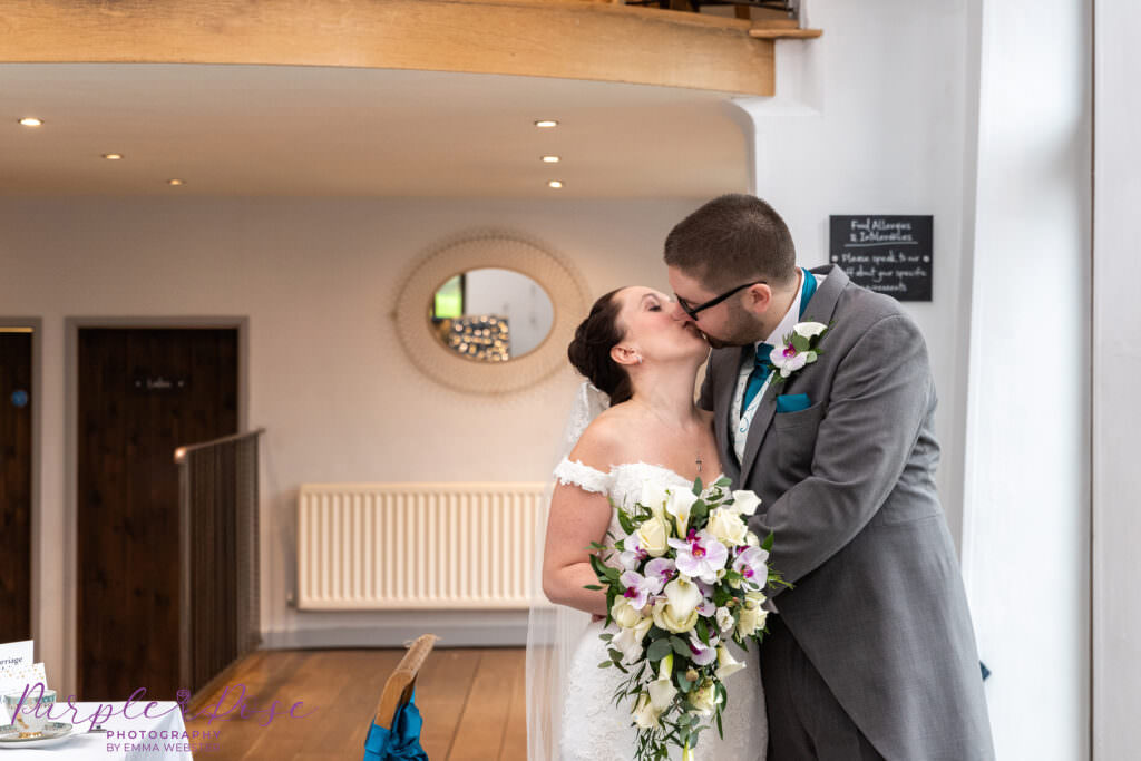 Bride and groom kissing