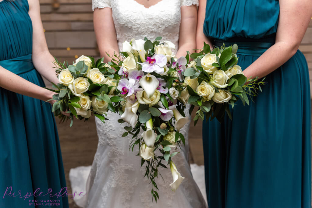 Bridal party holding thier bouquets