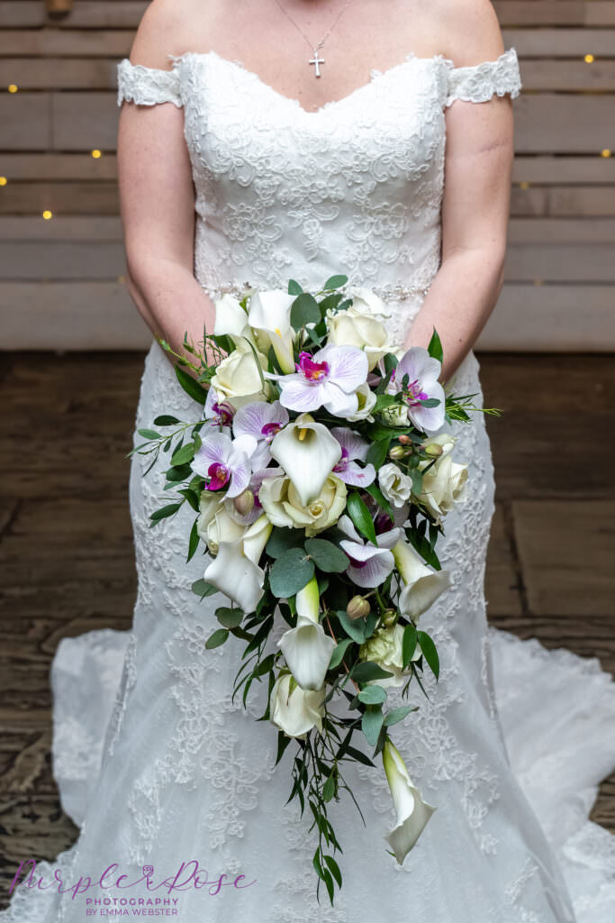 Close up of brides orchid wedding bouquet